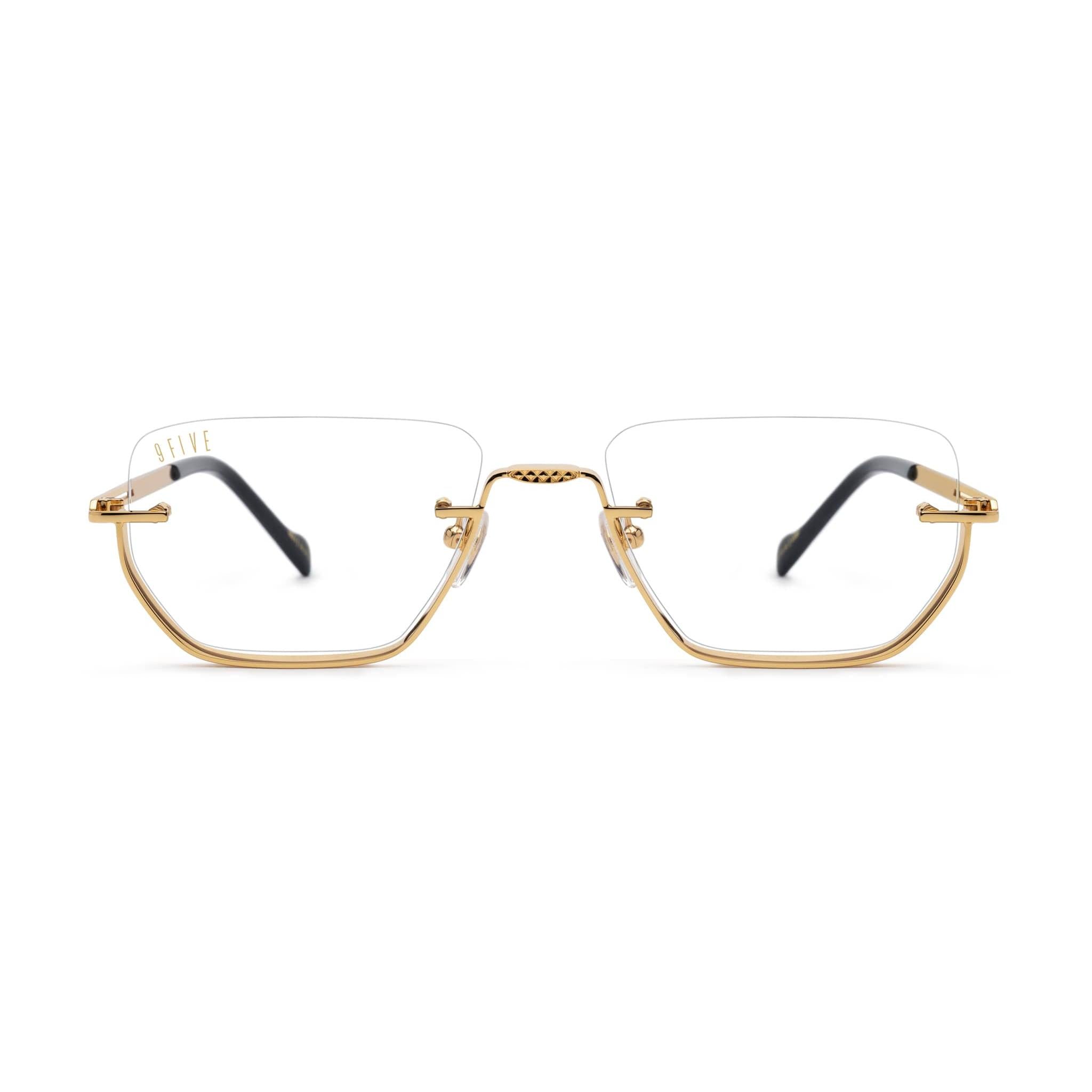 Gold-framed eyeglasses on a white background