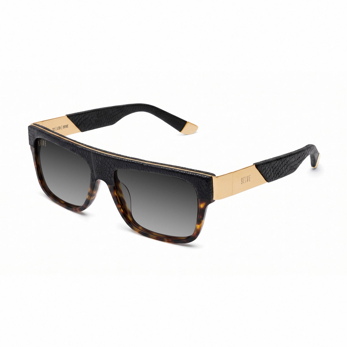 A pair of rectangular sunglasses with a black reptile-embossed front frame, dark lenses, and gold metal temples, shown against a plain white background. [g:black-gradient s:all o:2]