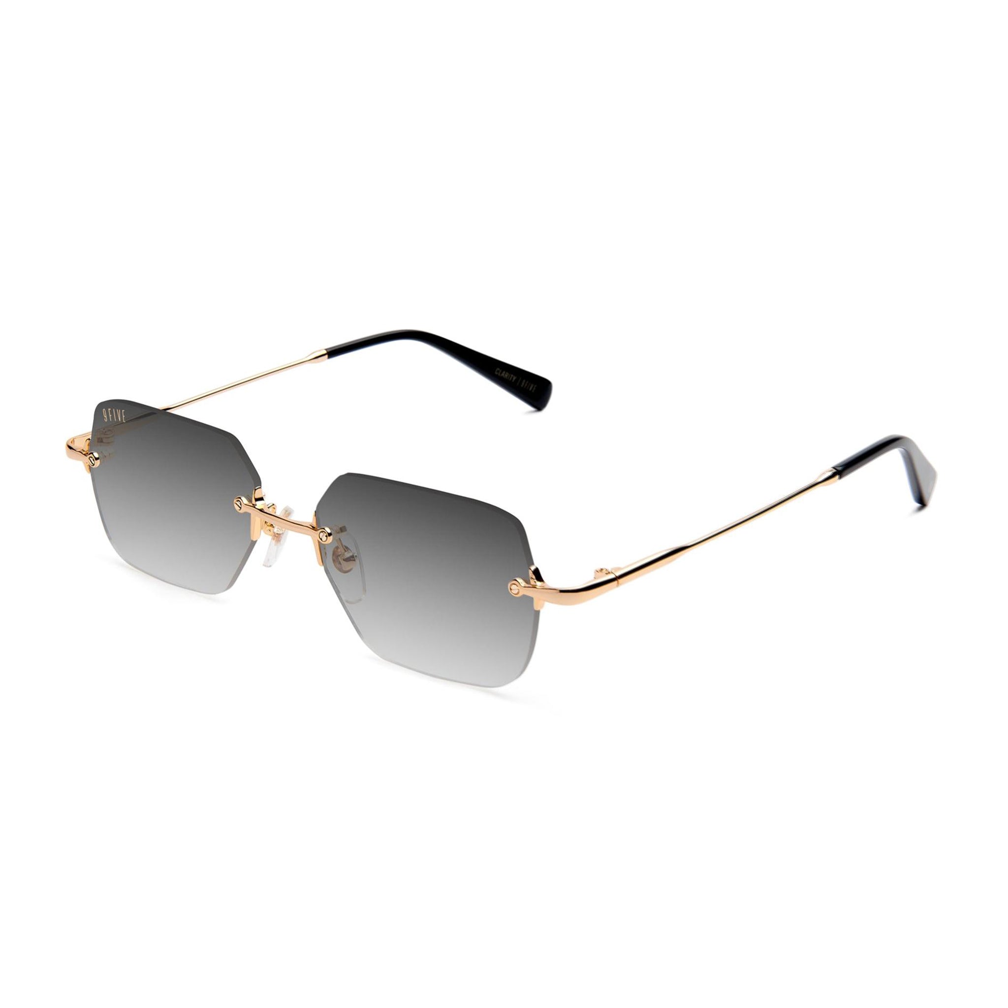 Rimless square sunglasses with gradient gray lenses, a gold metal frame, and black temple tips, shown on a plain white background.
[g:black-gradient s:all o:2]
