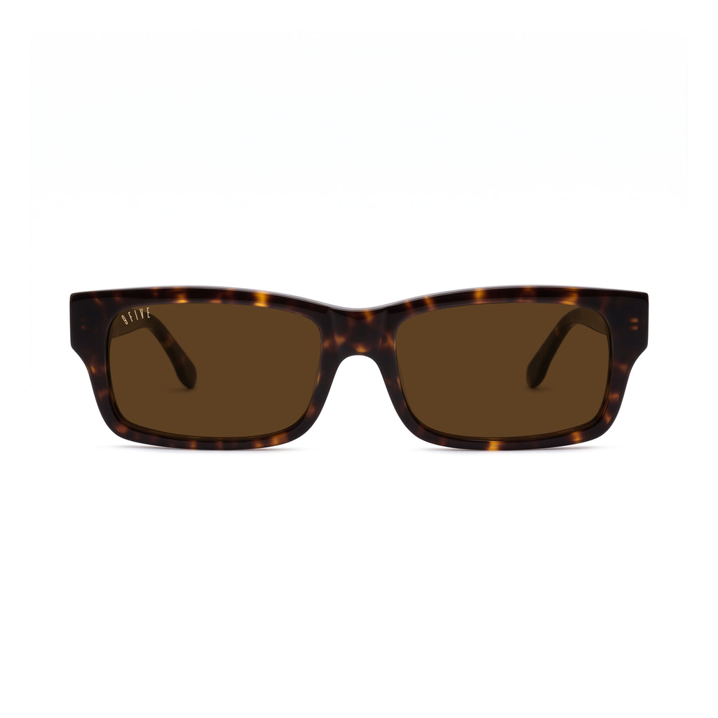 A pair of rectangular sunglasses with a dark brown and amber tortoiseshell frame and brown lenses, shown against a plain white background. [g:brown s:all o:1]