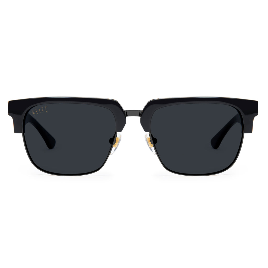 Black sunglasses with gold frames on a white background
[g:black s:all o:1]