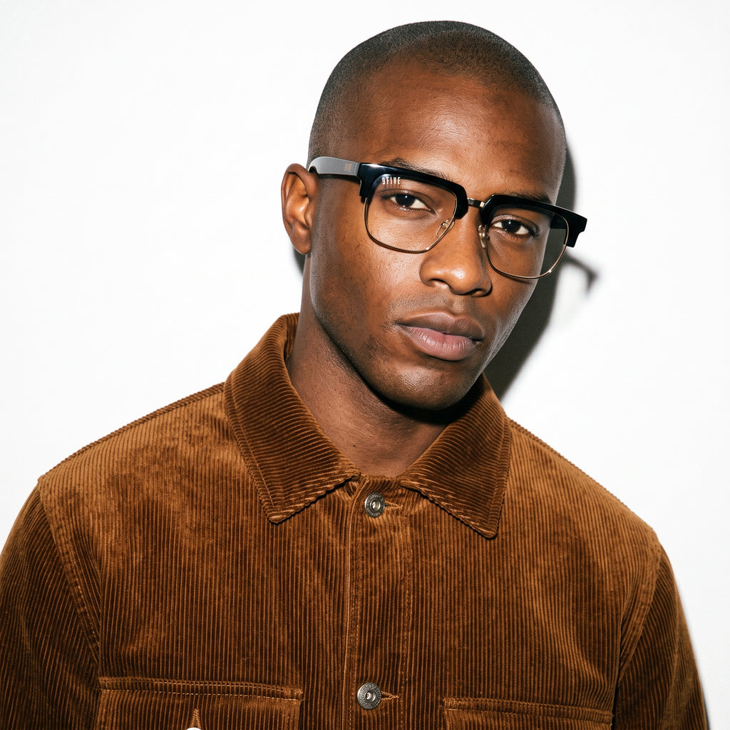 Man wearing a brown corduroy jacket and glasses on a white background [g:clear s:all o:3]