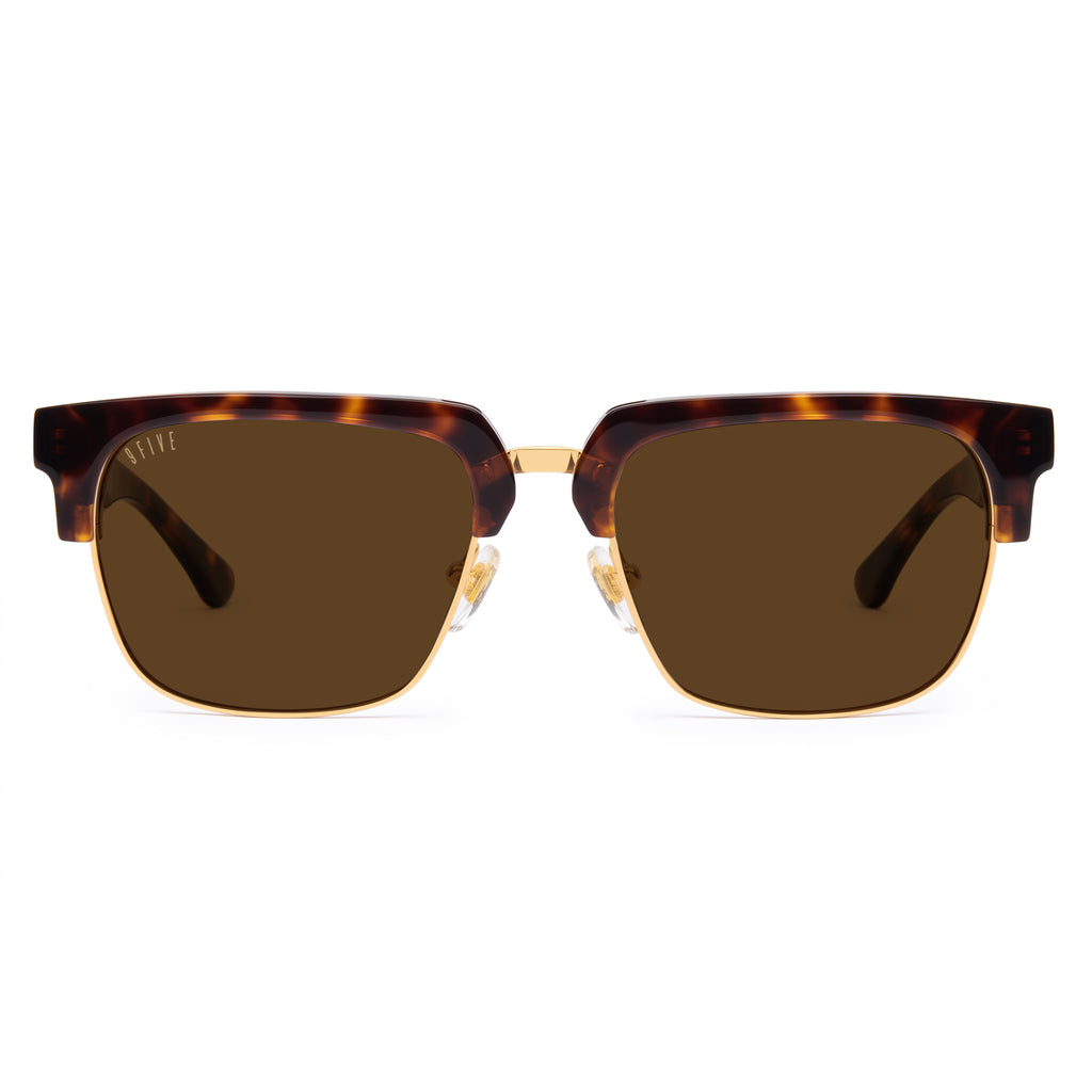 A pair of square club-master style sunglasses with a translucent tortoiseshell frame and dark brown lenses, shown against a plain white background. [g:brown s:all o:1]