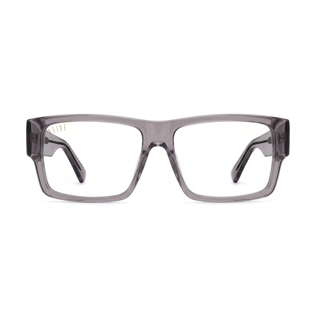 A pair of square sunglasses with a translucent smoky gray acetate frame and dark gray lenses, shown at a three-quarter angle on a plain white background.