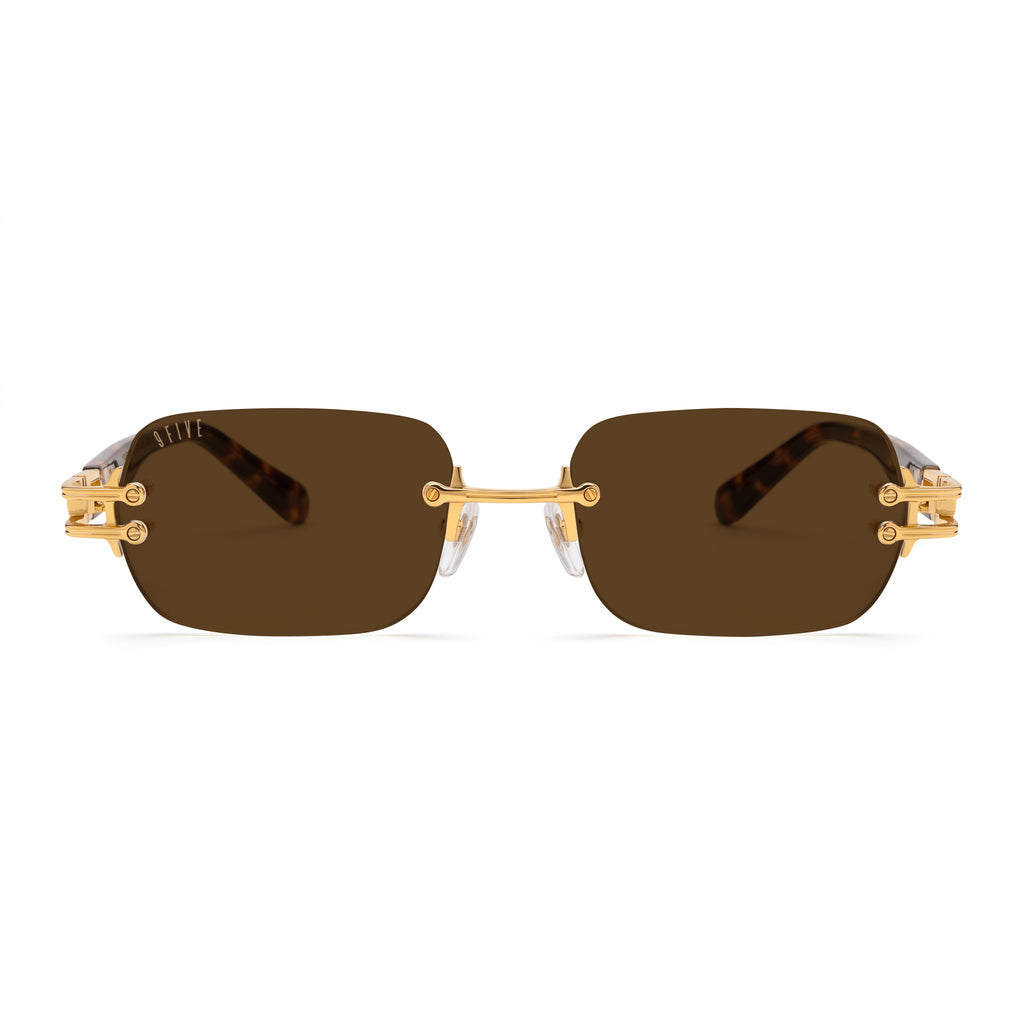 Rimless square sunglasses with dark brown lenses and gold metal hardware, shown from the front on a white background. [g:brown s:all o:1]