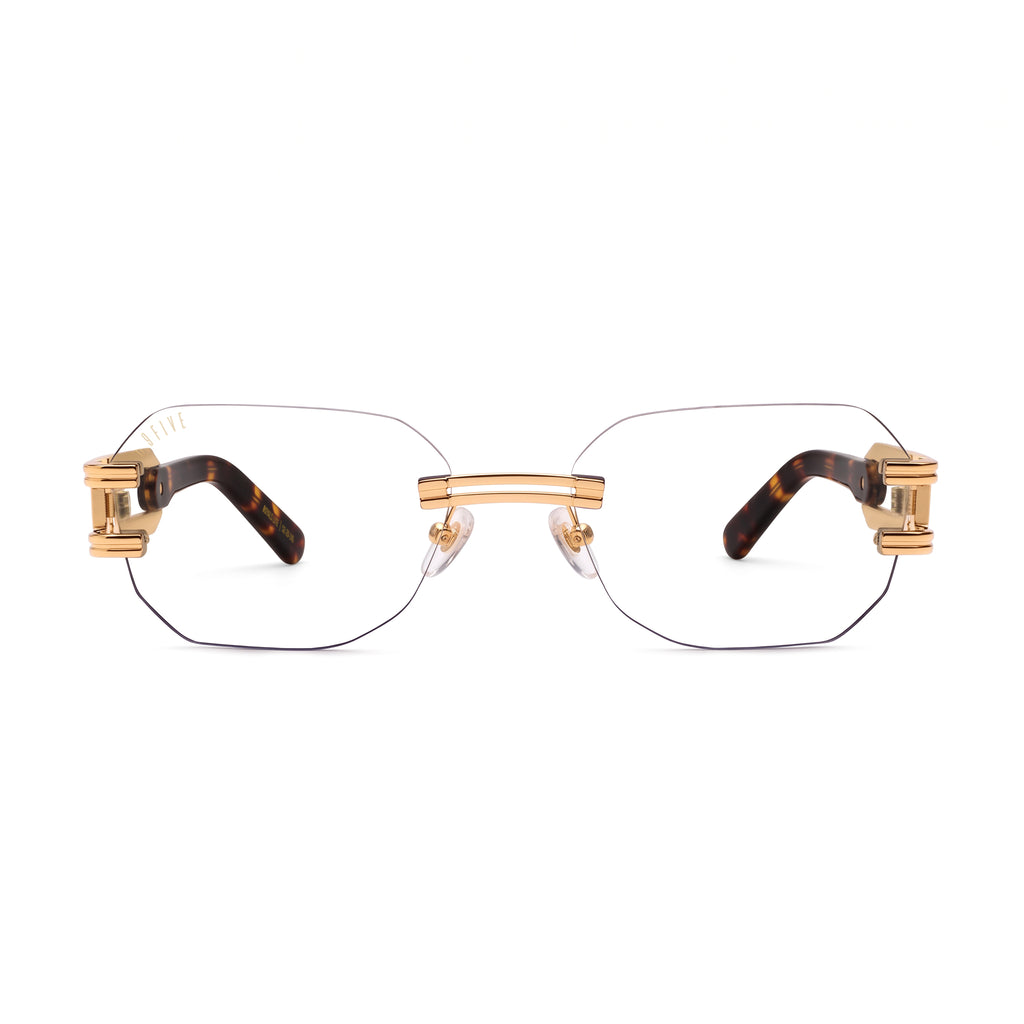 Rectangular rimless eyeglasses with gold metal hardware and tortoiseshell temple arms, shown against a plain white background. [g:clear s:all o:1]