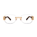 Rectangular rimless eyeglasses with gold metal hardware and tortoiseshell temple arms, shown against a plain white background. [g:clear s:all o:1]