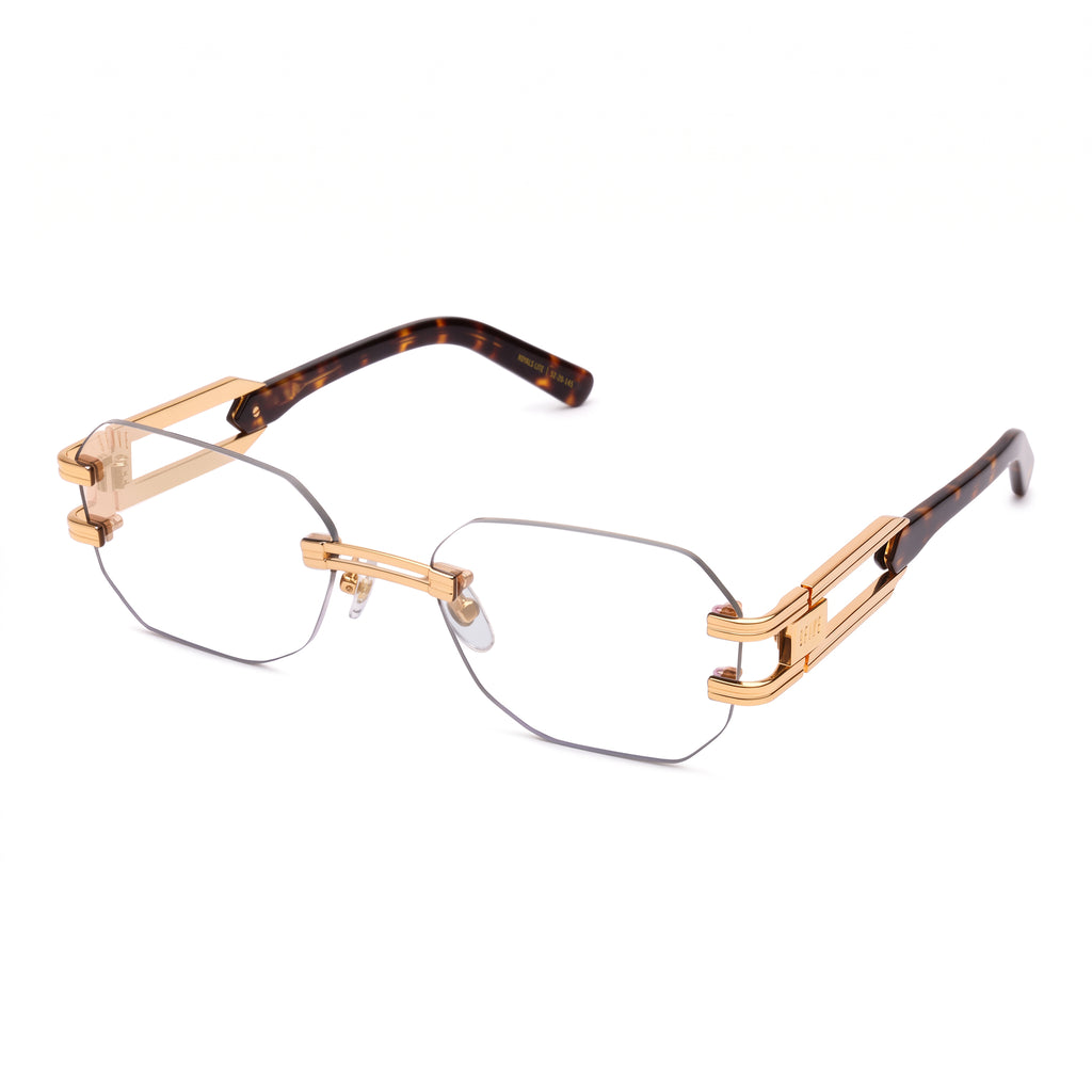 Rimless geometric eyeglasses with gold metal frames, clear lenses, and tortoiseshell temple arms, shown on a plain white background. . [g:clear s:all o:2]