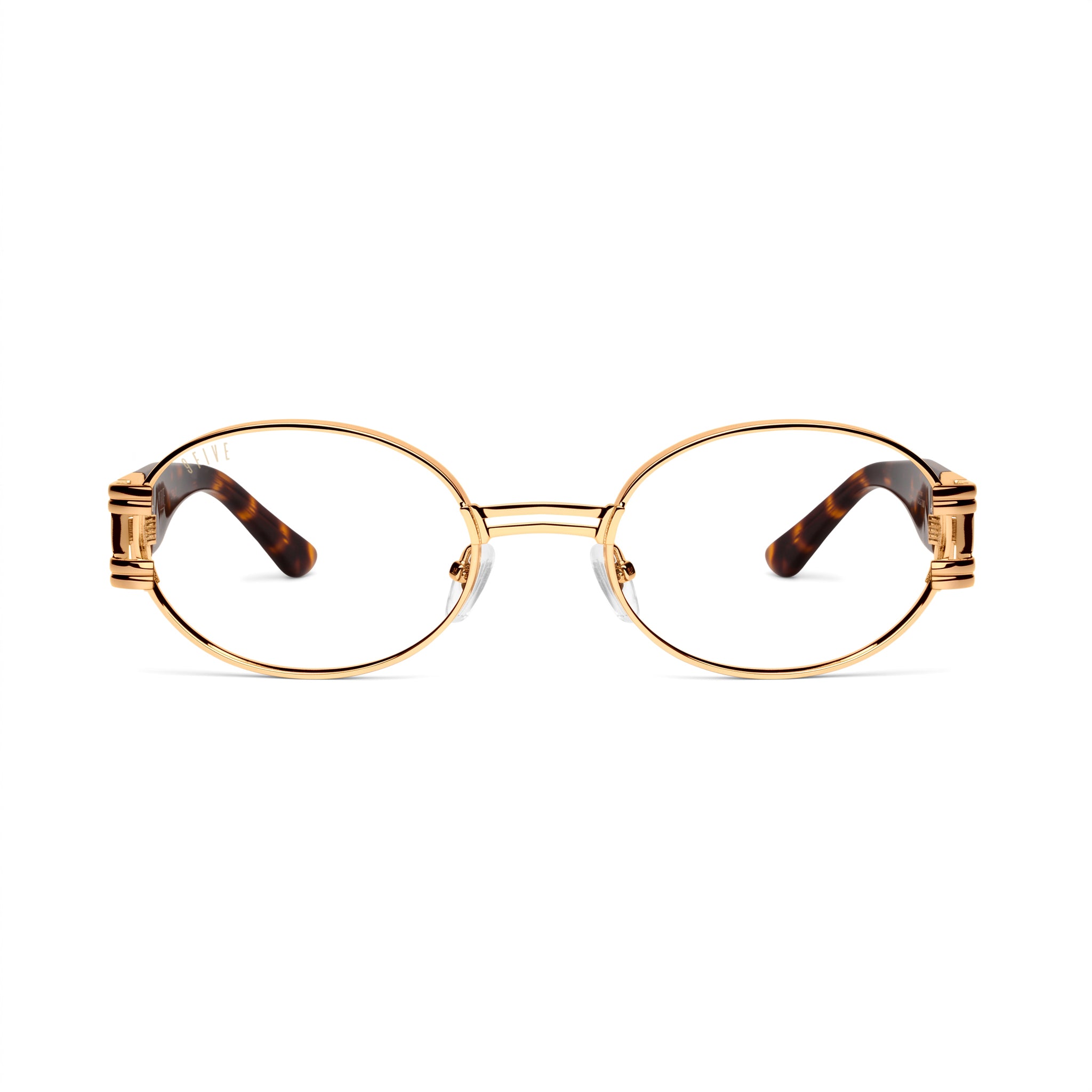 Oval eyeglasses with a gold metal frame and tortoiseshell temple arms, shown from the front on a white background. [g:clear s:all o:1]