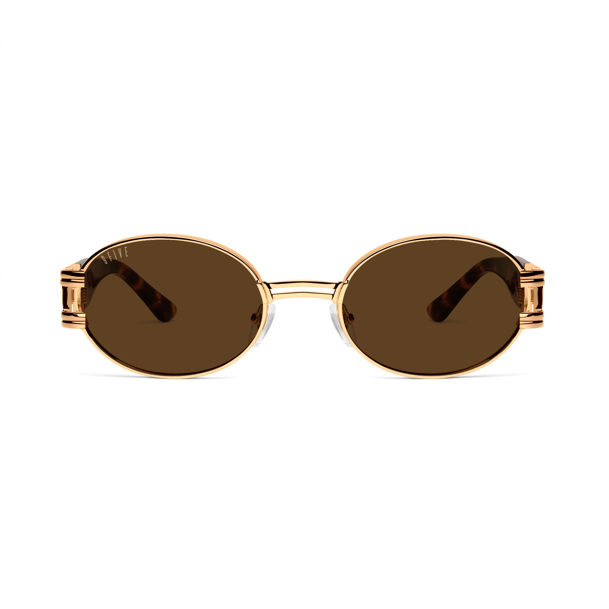 Oval sunglasses with gold metal frames, brown gradient lenses, and tortoiseshell acetate temples, shown on a clean white background. [g:brown s:all o:1]