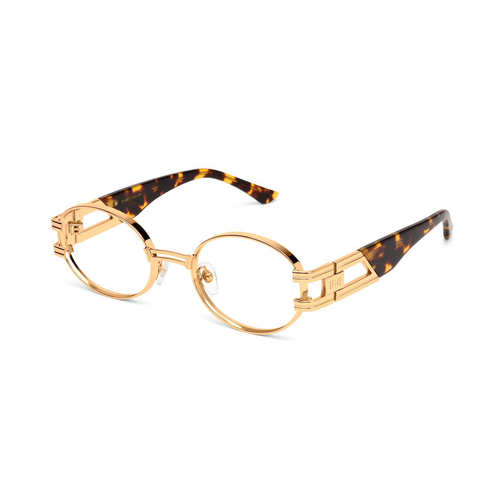 Oval eyeglasses with a gold metal frame and tortoiseshell temple arms, shown from the front on a white background. [g:clear s:all o:2]